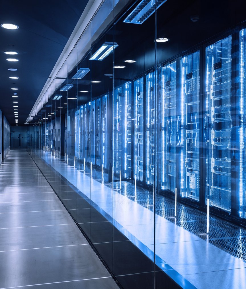 High-tech data center featuring multiple server racks illuminated by blue LED lighting in a clean, r